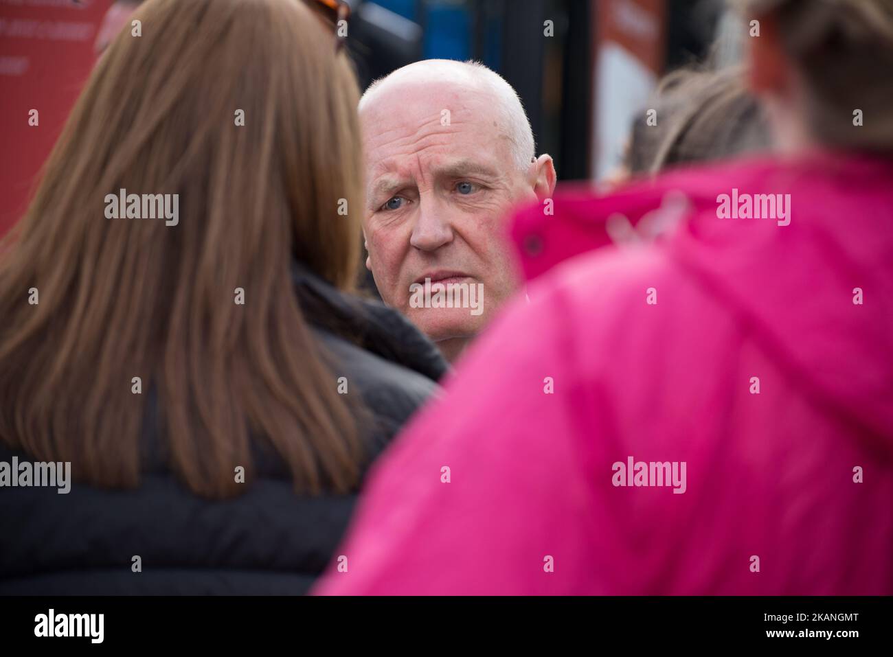 John Holden, Mayor of Trafford, speaks to people arriving at the Old