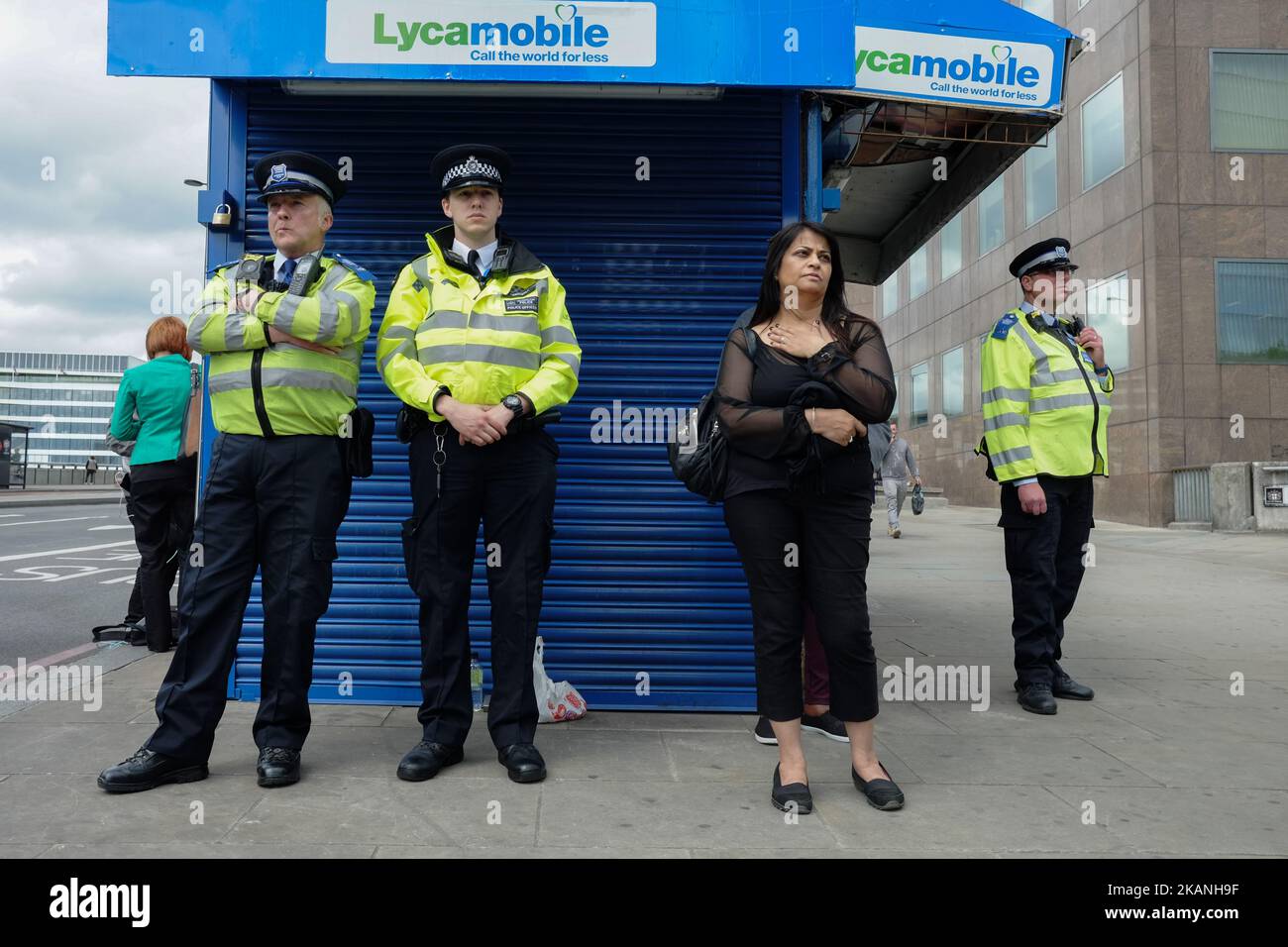 People lay flowers near the police cordon in London, on June 6, 2017 where terrorists killed six people on Saturday night. London police made a fresh round of arrests Monday after the country's third terror attack in less than three months as Prime Minister Theresa May came under mounting pressure over security three days ahead of elections. The aftermath of Saturday night's rampage, which left seven dead and dozens wounded, dominated the campaign trail. (Photo by Jay Shaw Baker/NurPhoto) *** Please Use Credit from Credit Field *** Stock Photo