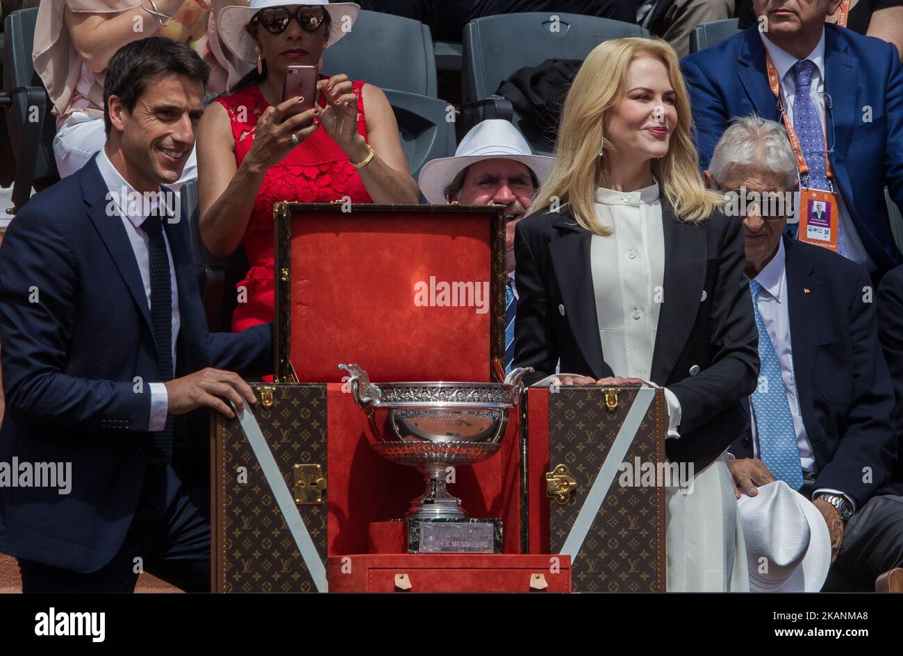 Nicole Kidman, Australian - American actress and producer and Tony Estanguet who won three Olympic gold medals and co-chairs Paris 2024 present the Coupe des Mousquetaires in its Louis Vuitton travel case to spectators before the men’s final at Roland Garros Grand Slam Tournament - Day 15 on June 11, 2017 in Paris, France. (Photo by Robert Szaniszló/NurPhoto) *** Please Use Credit from Credit Field *** Stock Photo