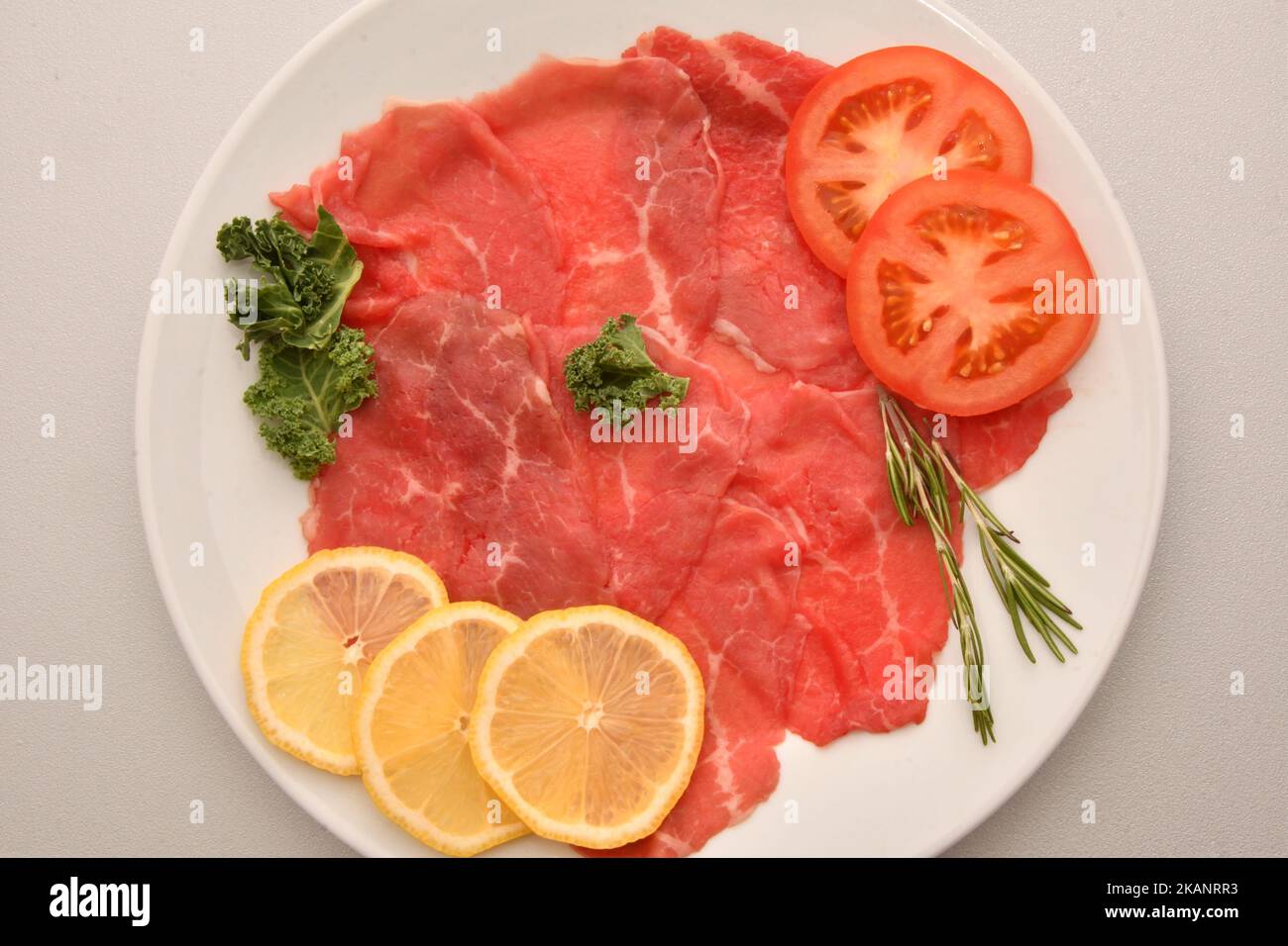 Beef carpaccio and fresh herbs for the Christmas table Stock Photo