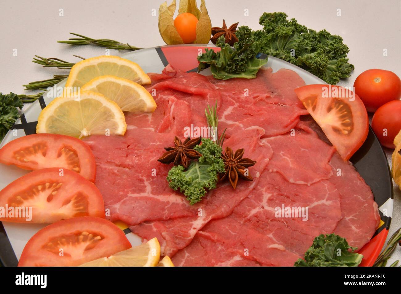 Beef carpaccio and fresh herbs for the Christmas table Stock Photo