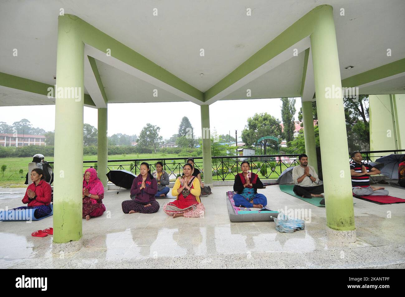 Nepalese yoga enthusiast people performing Yoga Position during the celebration of International Day of Yoga organized by Yog Sadhana Samaj at Kirtipur, Nepal on Wednesday, June 21, 2017. Yog Sadhana Samaj organizing free yoga morning classes 'Kirtipur Yoga Science' since from past 10 years in Kirtipur. (Photo by Narayan Maharjan/NurPhoto) *** Please Use Credit from Credit Field *** Stock Photo