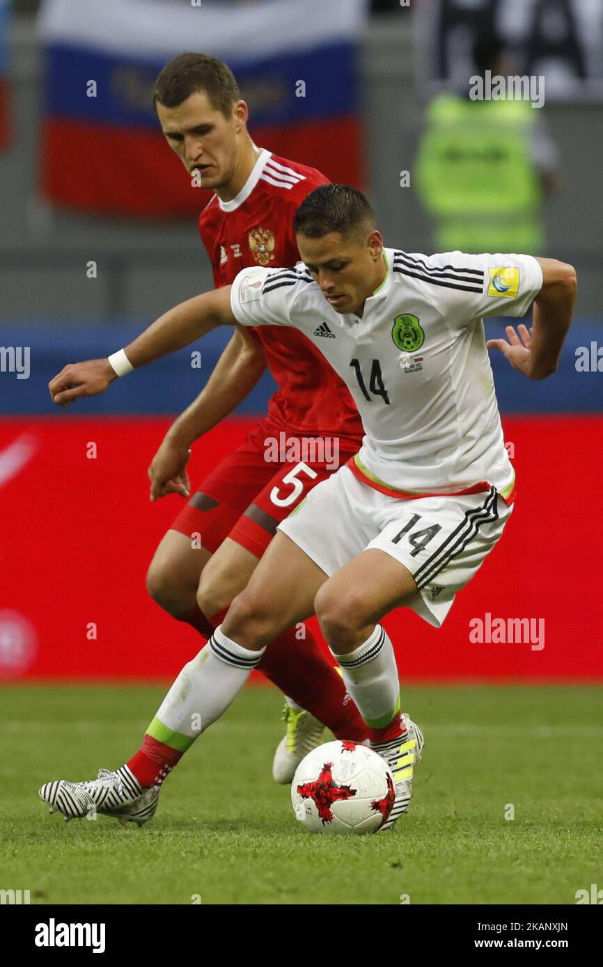 Viktor Vasin (L) of Russia national team and Javier Hernandez of Mexico national team vie for the ball during the Group A - FIFA Confederations Cup Russia 2017 match between Russia and Mexico at Kazan Arena on June 24, 2017 in Kazan, Russia. (Photo by Mike Kireev/NurPhoto) *** Please Use Credit from Credit Field *** Stock Photo