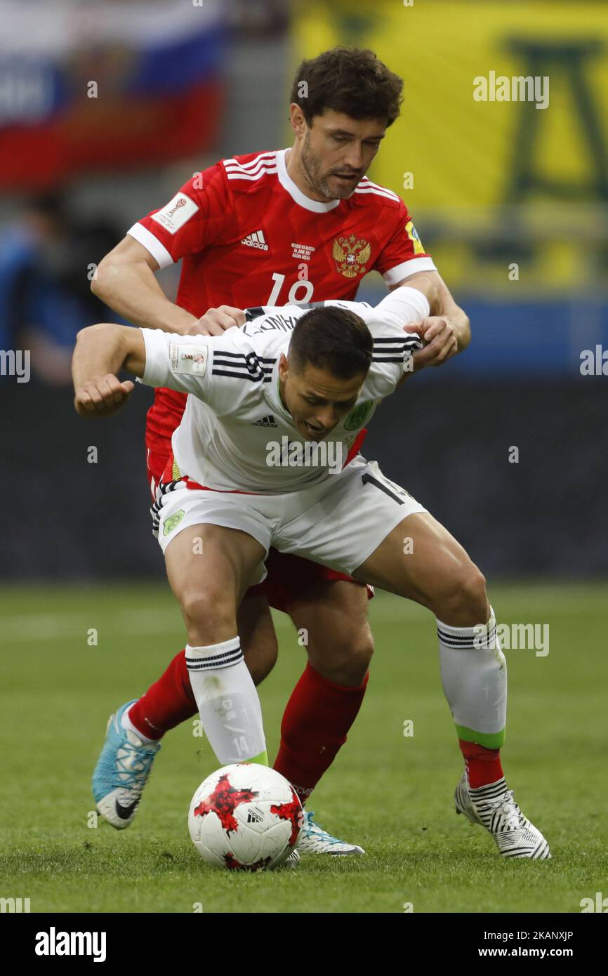 Yury Zhirkov of Russia national team and Javier Hernandez (in front) of Mexico national team vie for the ball during the Group A - FIFA Confederations Cup Russia 2017 match between Russia and Mexico at Kazan Arena on June 24, 2017 in Kazan, Russia. (Photo by Mike Kireev/NurPhoto) *** Please Use Credit from Credit Field *** Stock Photo