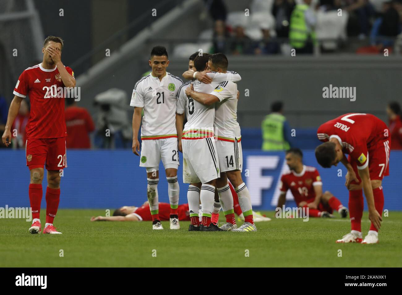 Russia national team players Maksim Kanunnikov (L), Alexander Samedov (2nd R) and Dmitry Poloz (R) react as Mexico national team players Luis Reyes (N21), Javier Hernandez (N14) and Jonathan Dos Santos celebrate victory during the Group A - FIFA Confederations Cup Russia 2017 match between Russia and Mexico at Kazan Arena on June 24, 2017 in Kazan, Russia. (Photo by Mike Kireev/NurPhoto) *** Please Use Credit from Credit Field *** Stock Photo