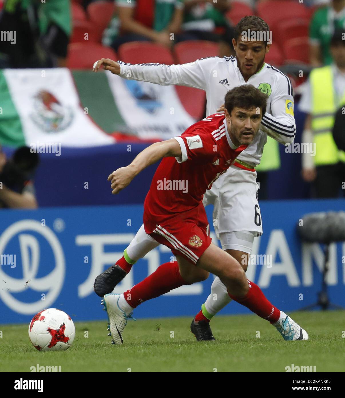 Yury Zhirkov (L) of Russia national team and Jonathan Dos Santos of Mexico national team vie for the ball during the Group A - FIFA Confederations Cup Russia 2017 match between Russia and Mexico at Kazan Arena on June 24, 2017 in Kazan, Russia. (Photo by Mike Kireev/NurPhoto) *** Please Use Credit from Credit Field *** Stock Photo