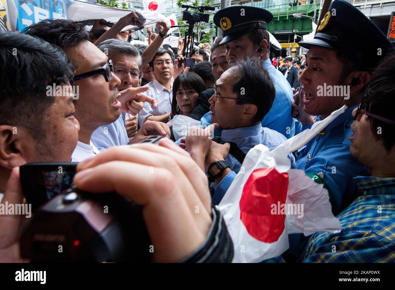 Anti-Abe protesters clash with Japanese police during the speech of Japanese Prime Minister Shinzo Abe for his candidate Aya Nakamura of main opposition, Liberal Democratic Party (LDP) in Akihabara, Tokyo, Japan on July 1, 2017. Tokyo Metropolitan Assembly election will be held on July 2. (Photo by Richard Atrero de Guzman/NurPhoto) *** Please Use Credit from Credit Field *** Stock Photo