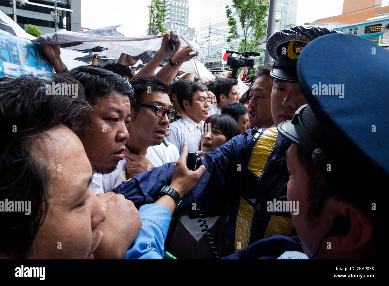 Anti-Abe protesters clash with Japanese police during the speech of Japanese Prime Minister Shinzo Abe for his candidate Aya Nakamura of main opposition, Liberal Democratic Party (LDP) in Akihabara, Tokyo, Japan on July 1, 2017. Tokyo Metropolitan Assembly election will be held on July 2. (Photo by Richard Atrero de Guzman/NurPhoto) *** Please Use Credit from Credit Field *** Stock Photo
