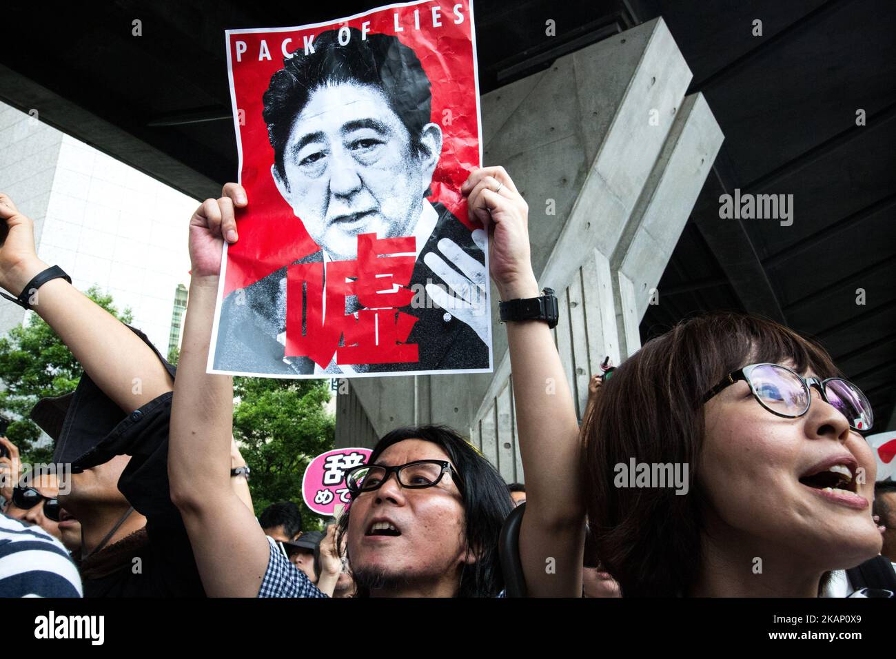 Anti-Abe protesters gathers and chant “Abe wa Yamero!” 'Resign Prime Minister Abe!” during the speech of Japanese Prime Minister Shinzo Abe for his candidate Aya Nakamura of main opposition, Liberal Democratic Party (LDP) in Akihabara, Tokyo, Japan on July 1, 2017. Tokyo Metropolitan Assembly election will be held on July 2. (Photo by Richard Atrero de Guzman/NurPhoto) *** Please Use Credit from Credit Field *** Stock Photo