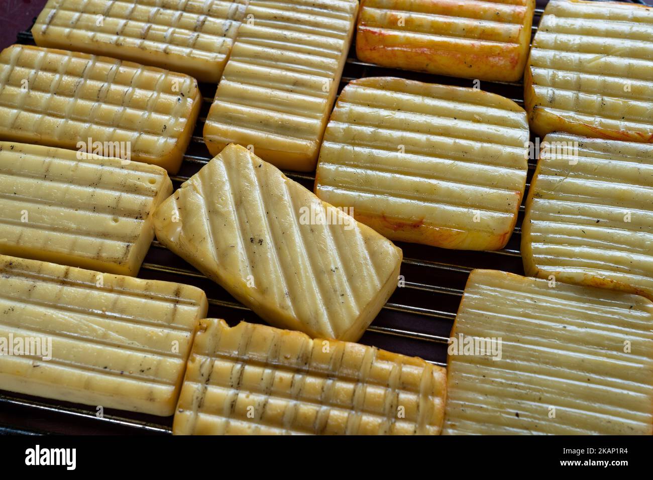 A closeup shot of Maroilles cheese on a rack Stock Photo