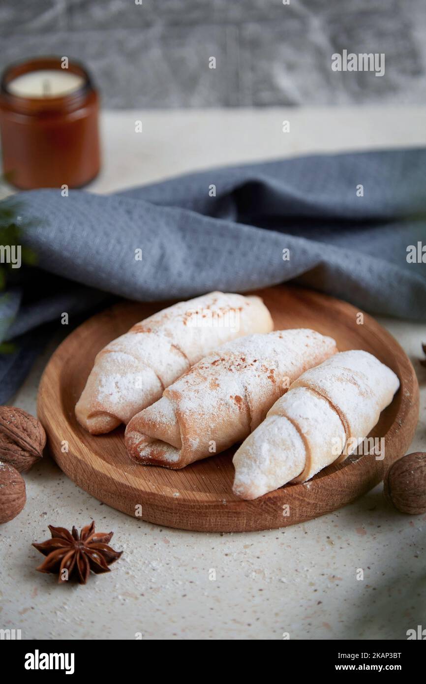 Christmas atmospheric crescent bagels with cinnamon sticks, star anise and walnuts. Stock Photo