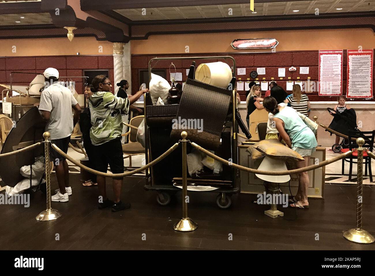 Members of the public check out after purchasing items during the third day of a liquidation sale at the former Trump Taj Mahal Casino and Resort in Atlantic City, New Jersey, on July 8, 2017. The property recently changed hands for $50 million and will be redeveloped in a Hard Rock Cafe owned resort. (Photo by Bastiaan Slabbers/NurPhoto) *** Please Use Credit from Credit Field *** Stock Photo