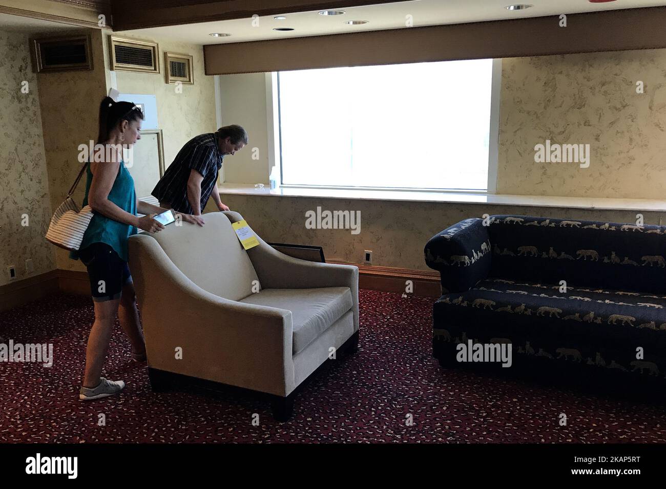 Members of the public browse hallways and some of the 1250 rooms during a large scale liquidation sale at the former Trump Taj Mahal Casino and resort, in Atlantic City, on July 8, 2017. The property recently changed hands for $50 million and will be redeveloped in a Hard Rock Cafe owned resort. (Photo by Bastiaan Slabbers/NurPhoto) *** Please Use Credit from Credit Field *** Stock Photo