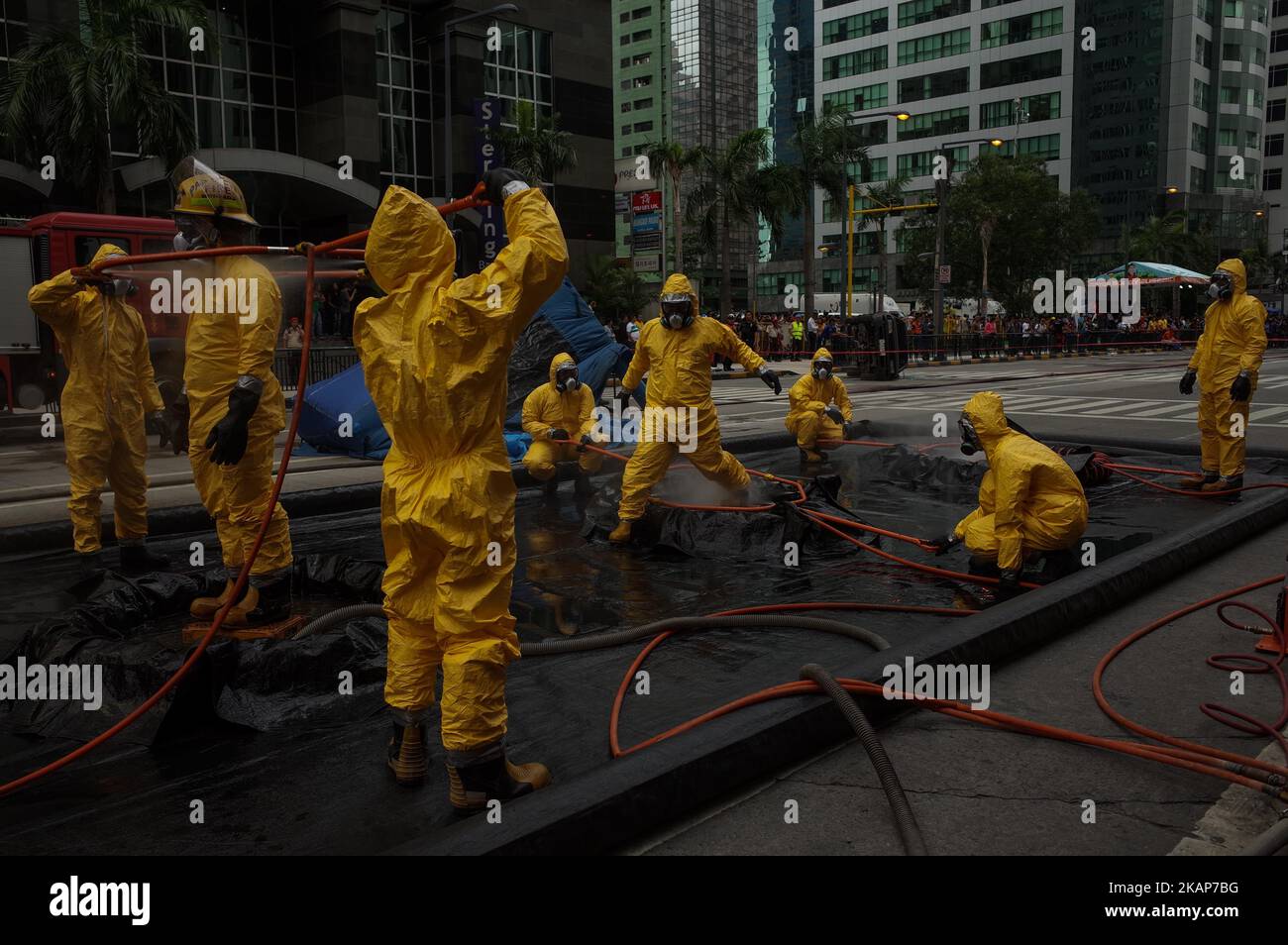 Rescue workers enter a decontamination area during an anti-terrorism drill in Pasig City, east of Manila, Philippines on July 14, 2017. The local government of Pasig City held its first anti-terrorism drill to showcase its capabilities in the event of a terrorist attack in the city. (Photo by Richard James Mendoza/NurPhoto) *** Please Use Credit from Credit Field *** Stock Photo