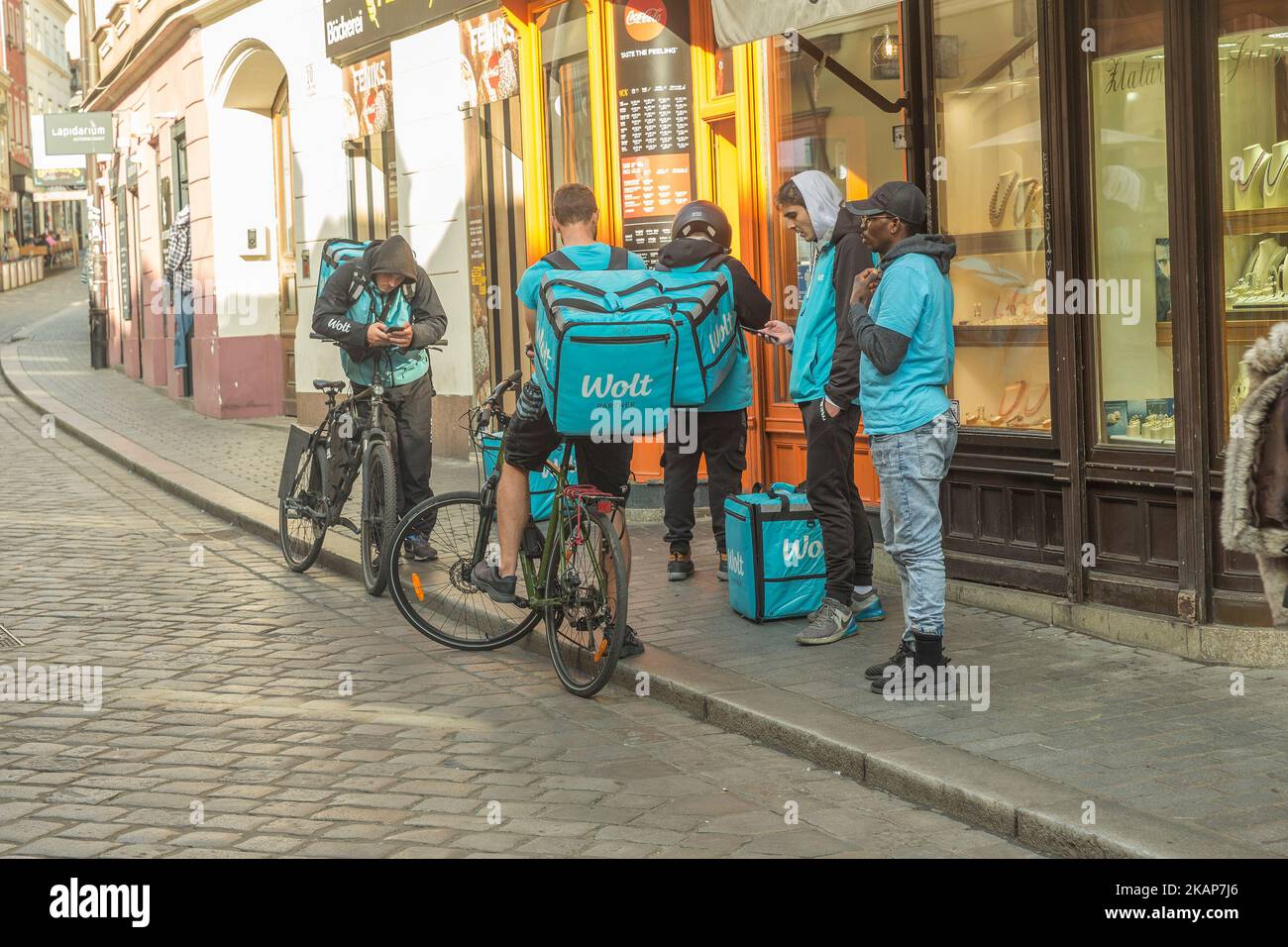 Food delivery bikers Stock Photo - Alamy