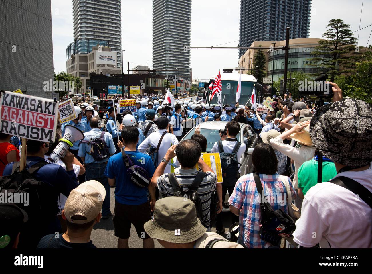 Anti-racist groups tried to block Japanese nationalists from marching on the street during a counter-protest rally demanding an end to hate speech in Kawasaki City, Kanagawa prefecture, Japan on July 16, 2017. Scuffles erupted during a counter-protest on racism in Kawasaki City's Nakahara on Sunday, during a right-wing activists attempt to march with their slogans, flags, racist speech, forcing police to intervene. (Photo by Richard Atrero de Guzman/NUR Photo) *** Please Use Credit from Credit Field *** Stock Photo