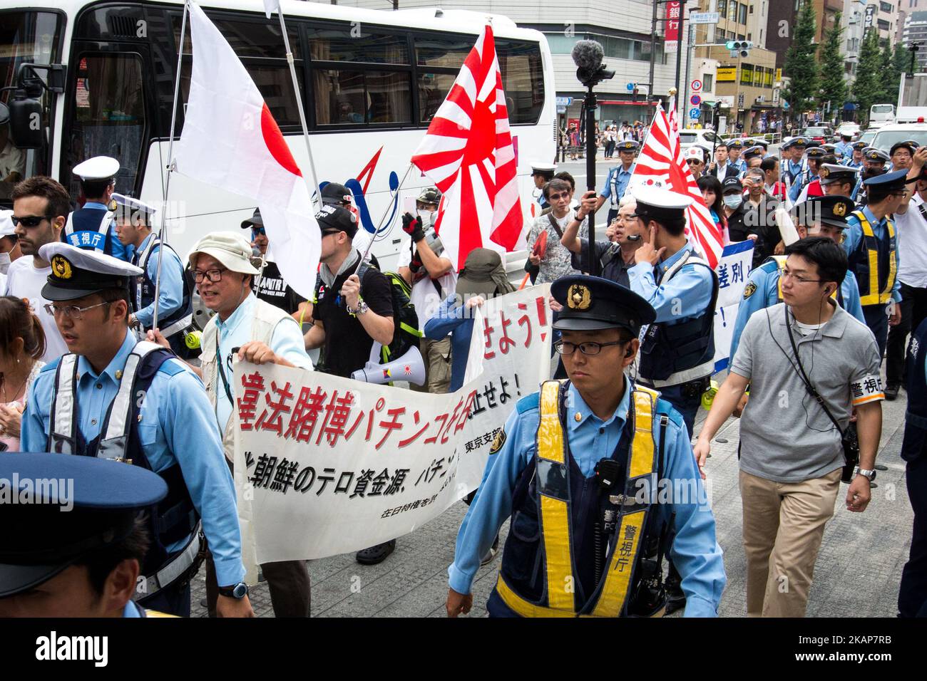 Japanese nationalists holding Japanese flags took to the streets in a 'hate demonstration' in Akihabara, Tokyo, Japan on July 16, 2017. The nationalists faced off with anti-racist groups who mounted counter protests demanding an end to hate speech and racism in Japan. (Photo by Richard Atrero de Guzman/NUR Photo) *** Please Use Credit from Credit Field *** Stock Photo