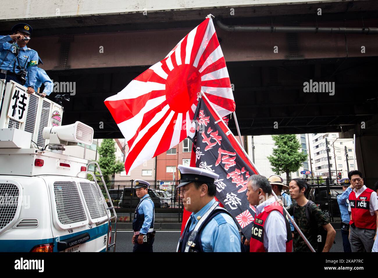 Japanese nationalists holding Japanese flags took to the streets in a 'hate demonstration' in Akihabara, Tokyo, Japan on July 16, 2017. The nationalists faced off with anti-racist groups who mounted counter protests demanding an end to hate speech and racism in Japan. (Photo by Richard Atrero de Guzman/NUR Photo) *** Please Use Credit from Credit Field *** Stock Photo