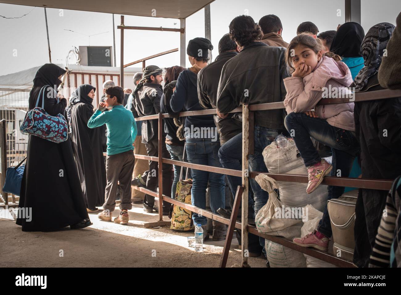 Syrian residents cross the border between Turkey and Syria at the the town of Kilis. Many of the Syrians crossing the border seek medical attention for injuries sustained from the ongoing war. Photos taken on March 10, 2016. (Photo by Diego Cupolo/NurPhoto) *** Please Use Credit from Credit Field *** Stock Photo