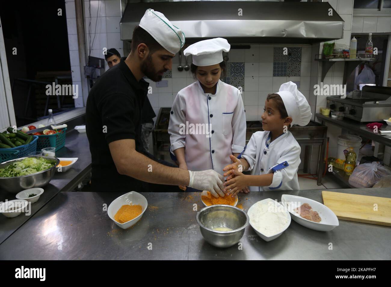 Palestinian children join in a training program on how to become a chef ...