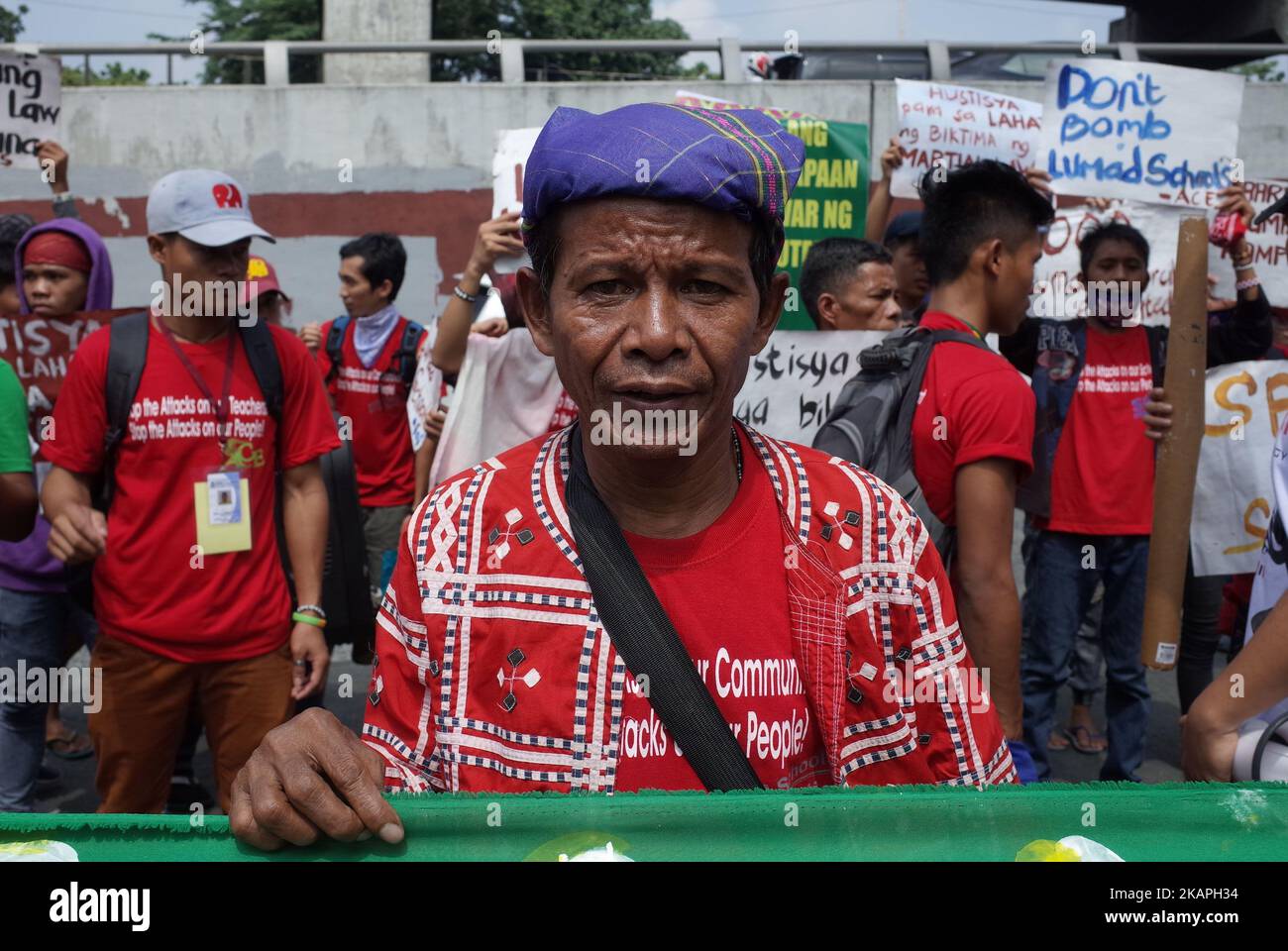 A Manobo indigenous tribesman poses for a photograph during a rally
