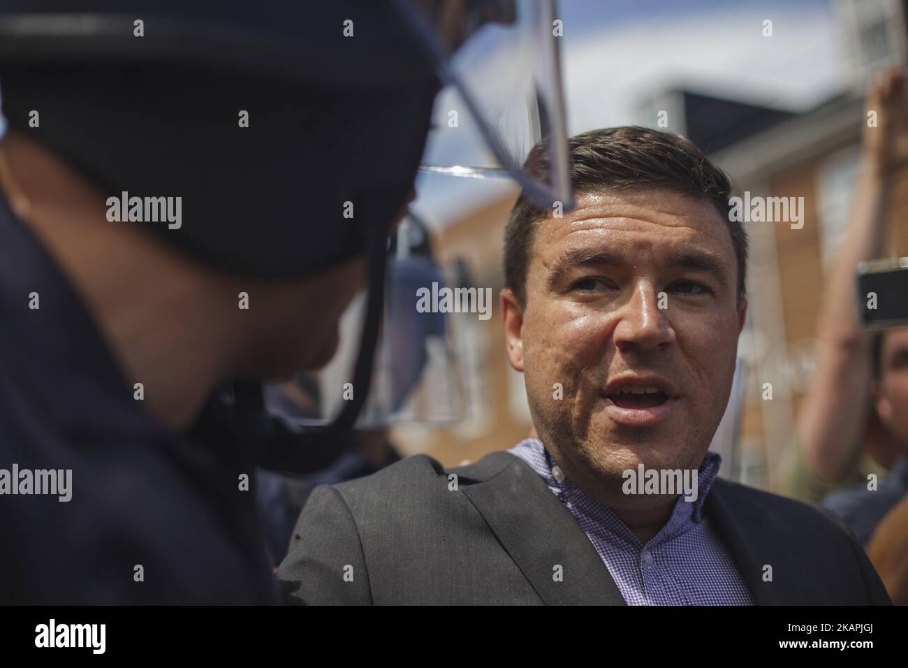 Jason Kessler communicating with State Police. 'How far is your car?' 'About a block away' 'THATS TOO FAR' Jason Kessler, one of the main organizers for the Unite The Right Rally held this weekend in Charlottesville, Attempted to hold a press conference to counter the events of Saturday. The conference last about 3 minutes before Kessler was evacuated by Virginia State Police in Charlottesville, VA on August 13, 2017. (Photo by Shay Horse/NurPhoto) *** Please Use Credit from Credit Field *** Stock Photo