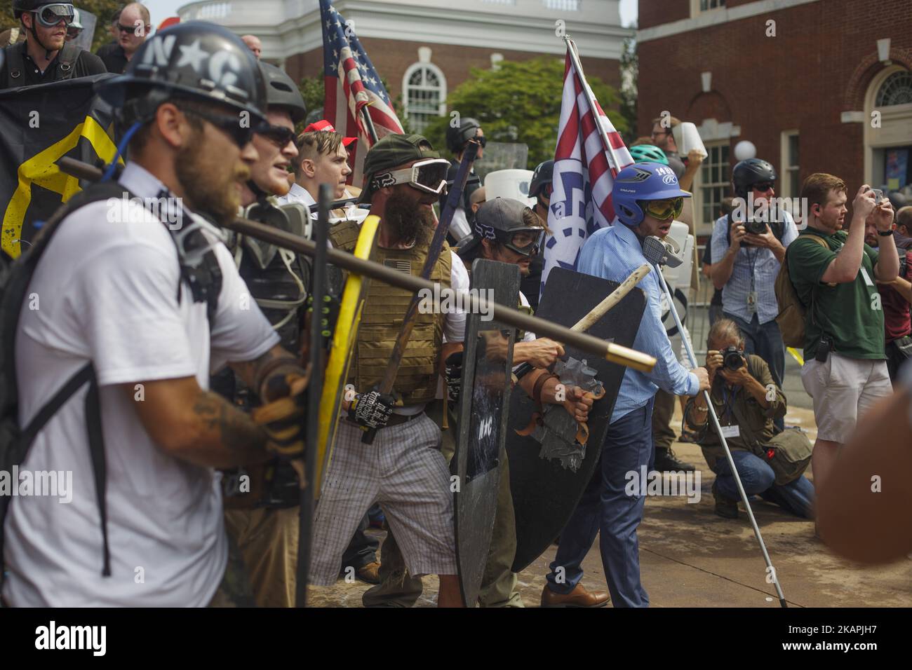 White Supremacists form a phalanx against counter protesters on August 12, 2017 in Charlottesville, Virginia, USA. The White Supremacists/Alt Right supporters were forcibly removed by police. (Photo by Shay Horse/NurPhoto) *** Please Use Credit from Credit Field *** Stock Photo