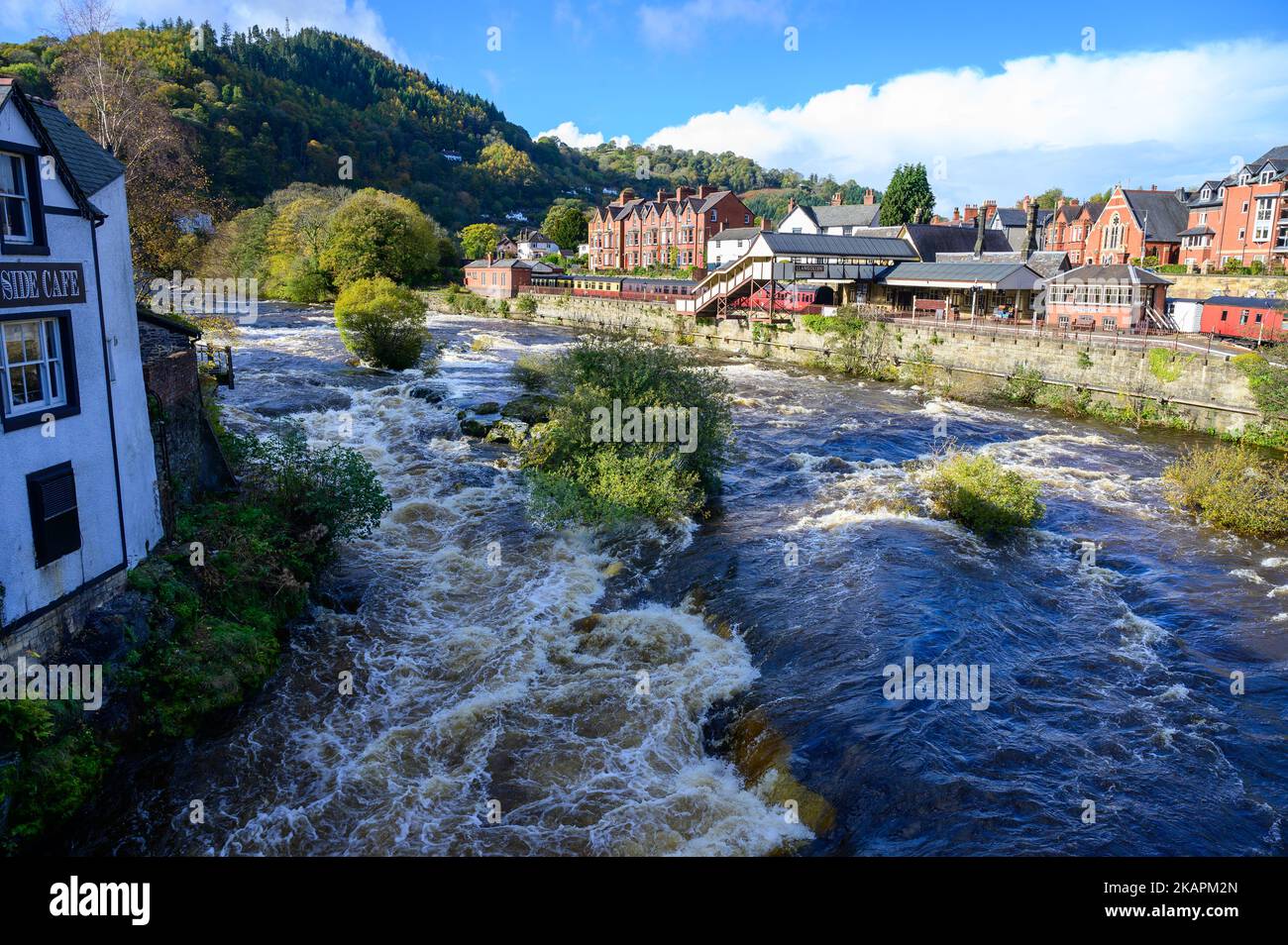 Looking down at the River Dee in Llangollen, Wales on a bright Autumn day with the water rushing below and foaming as it falls over the rocks. Stock Photo