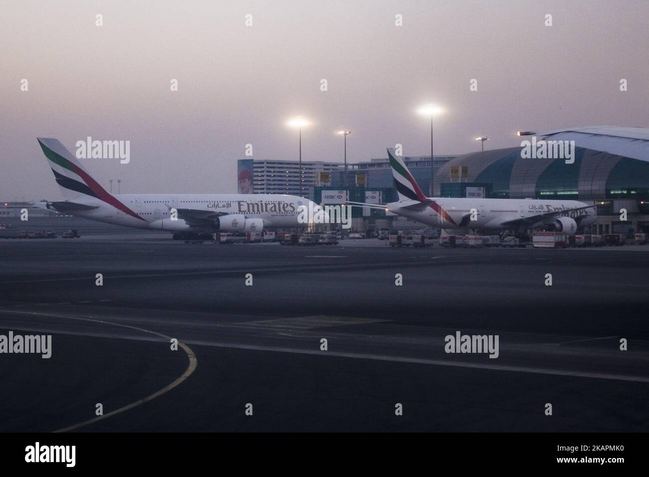 A picture taken on August 21, 2017 shows an Emirates airline Boeing 777 parked on the tarmac at Dubai airport, UAE. Dubai International Airport, the largest airport in space in the world and busiest airport by international passenger traffic. It is also the 3rd busiest airport in the world by total passenger traffic. About 84.000.000 million passengers passed in 2016 from DXB. Emirates and Fludubai are the primary users of the airport, connecting Middle East to all over the world. Also FedEx Express and Qantas uses the airport as a hub. (Photo by Nicolas Economou/NurPhoto) Stock Photo