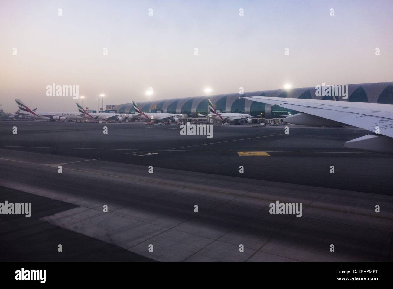 A picture taken on August 21, 2017 shows Emirates airline Boeing 777 parked on the tarmac at Dubai airport, UAE. Dubai International Airport, the largest airport in space in the world and busiest airport by international passenger traffic. It is also the 3rd busiest airport in the world by total passenger traffic. About 84.000.000 million passengers passed in 2016 from DXB. Emirates and Fludubai are the primary users of the airport, connecting Middle East to all over the world. Also FedEx Express and Qantas uses the airport as a hub. (Photo by Nicolas Economou/NurPhoto) Stock Photo