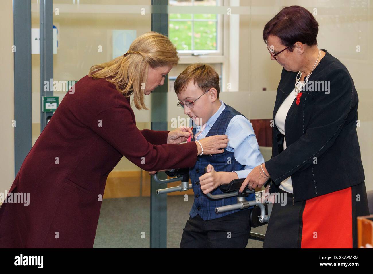 The youngest-ever honours recipient, fundraiser 'Captain' Tobias Weller, 11, with his mother Ruth Garbutt (right), is presented with his British Empire Medal (BEM) by the Countess of Wessex at his school in Sheffield. Picture date: Thursday November 3, 2022. Stock Photo