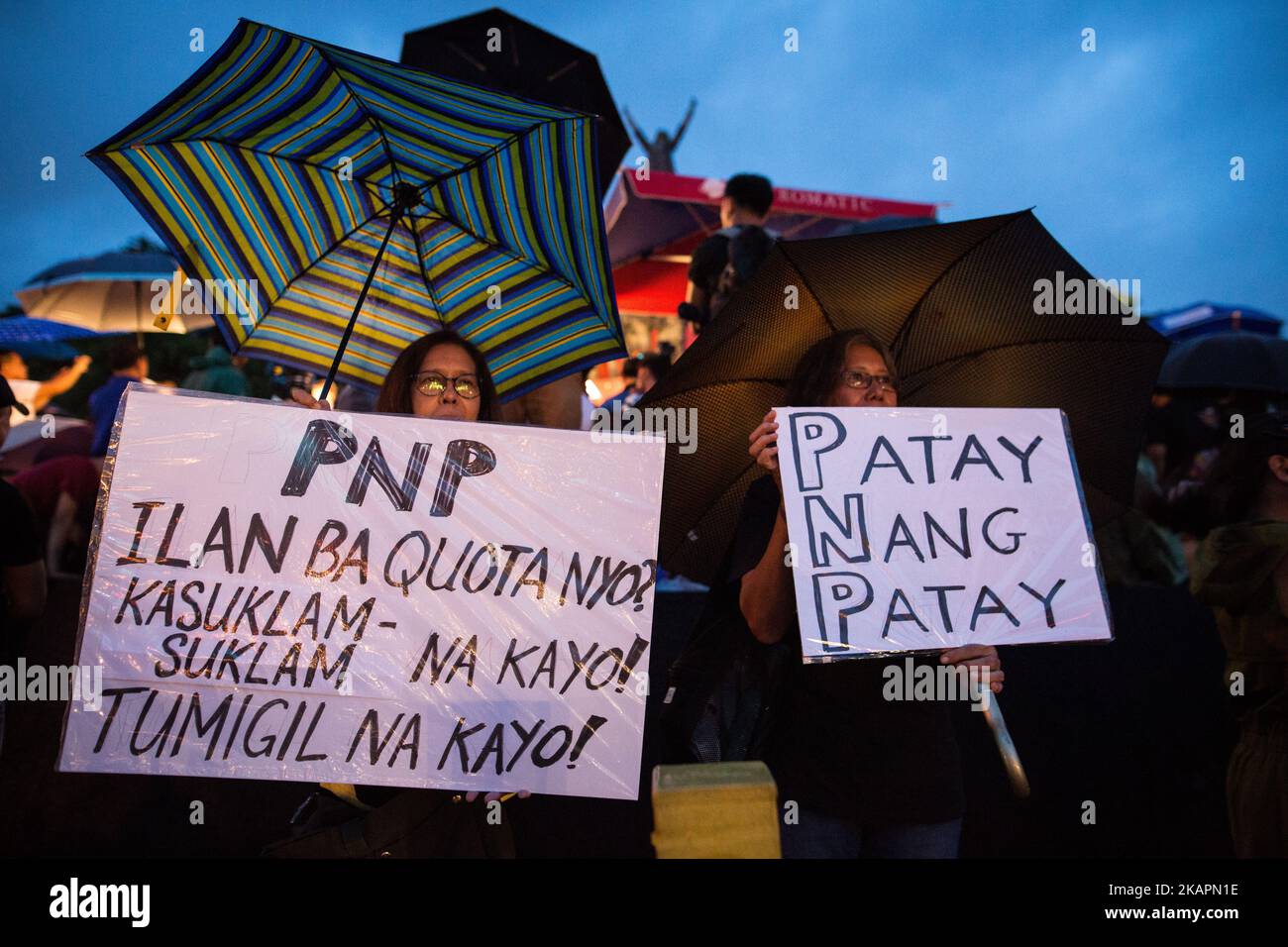 Protesters hold placards and slogans during a rally against extrajudicial killings in EDSA Shrine, Ortigas, Pasig City, Philippines on Monday, 21 August 2017. The death of Kian Delos Santos, who was killed by policemen in an alleged shootout, has sparked outrage among citizens related to the government's Philippine anti-drug operation. (Photo by Richard Atrero de Guzman/NurPhoto) Stock Photo