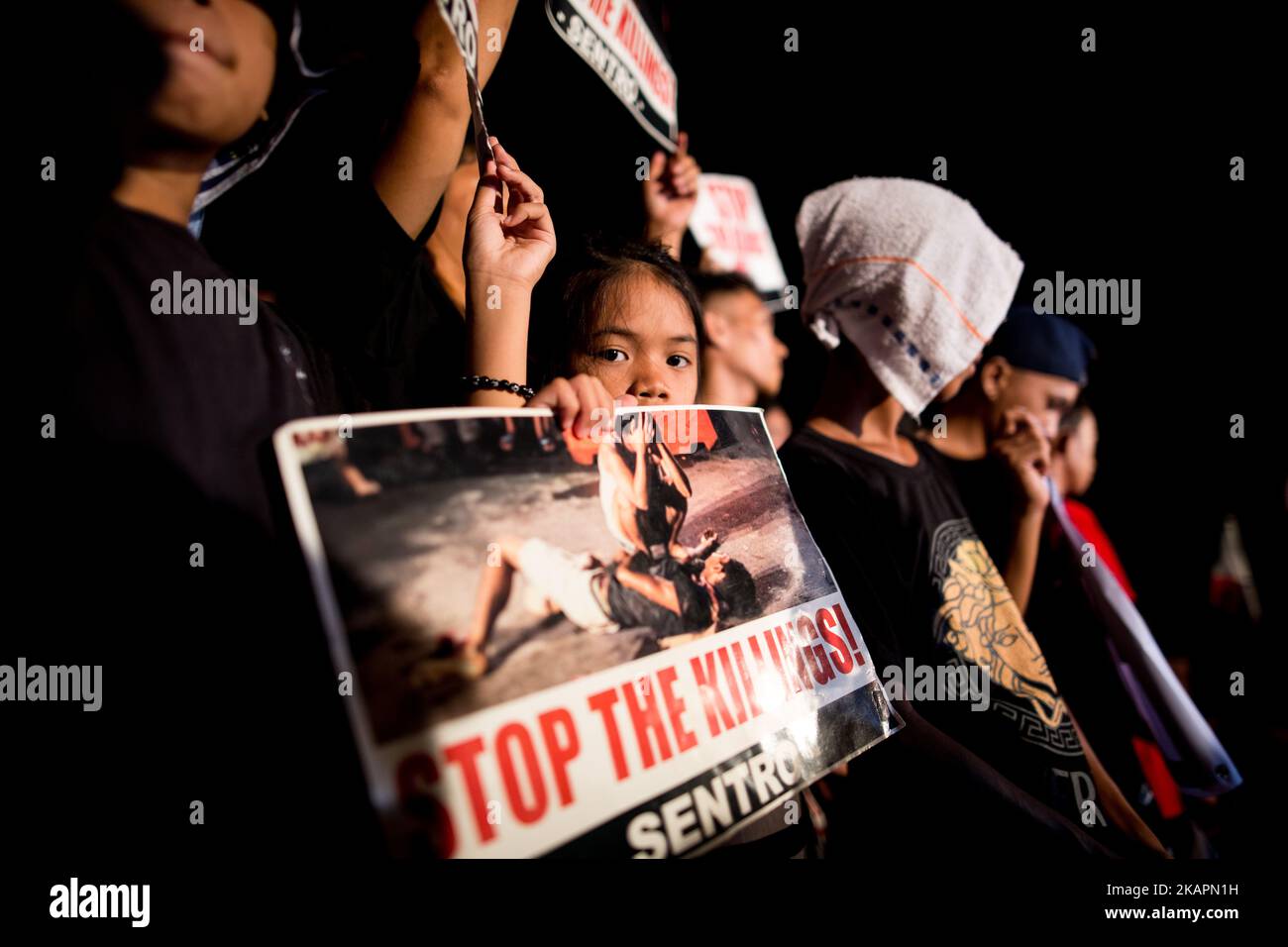 Protesters hold placards and slogans during a rally against extrajudicial killings in EDSA Shrine, Ortigas, Pasig City, Philippines on Monday, 21 August 2017. The death of Kian Delos Santos, who was killed by policemen in an alleged shootout, has sparked outrage among citizens related to the government's Philippine anti-drug operation. (Photo by Richard Atrero de Guzman/NurPhoto) Stock Photo