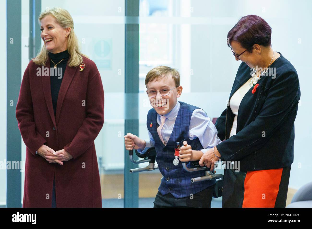 The youngest-ever honours recipient, fundraiser 'Captain' Tobias Weller, 11, with his mother Ruth Garbutt (right), is presented with his British Empire Medal (BEM) by the Countess of Wessex at his school in Sheffield. Picture date: Thursday November 3, 2022. Stock Photo