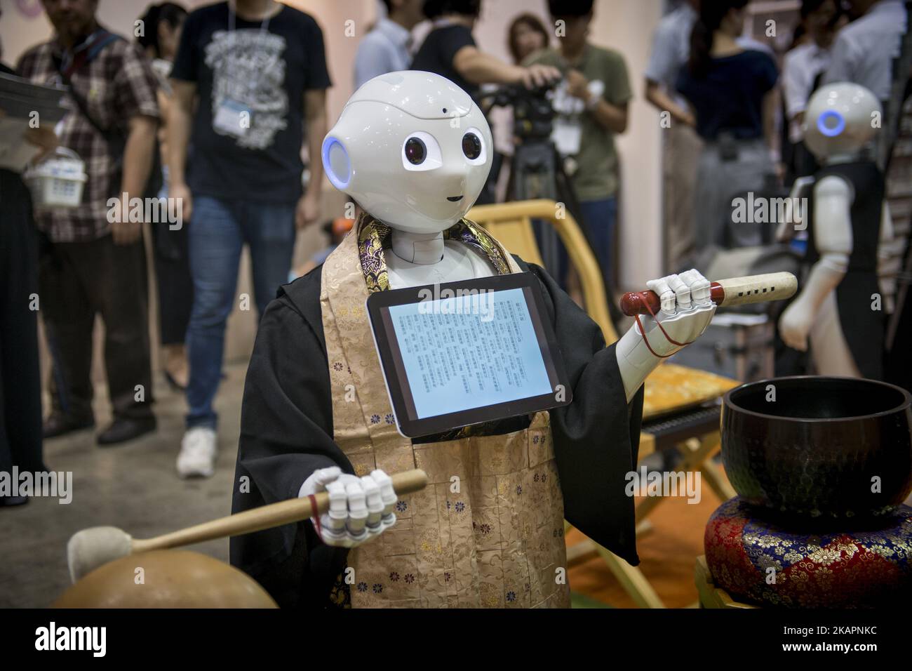 Pepper human-shaped robot while celebrating the Buddhist funeral rites to the Tokyo Int'l Funeral & Cemetery Show in Tokyo, Japan on August 23, 2017. Hundreds of funeral home operators, cemeteries operators, crematorium operators, traders, suppliers, buyers, professional associations and investors gather at this professional funeral event. (Photo by Alessandro Di Ciommo/NurPhoto) Stock Photo