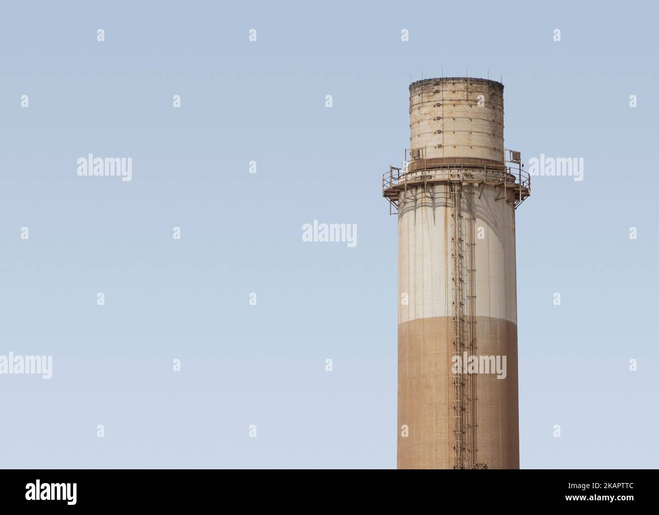 Top section of an industrial chimney on the banks of the river Nile, Egypt Stock Photo