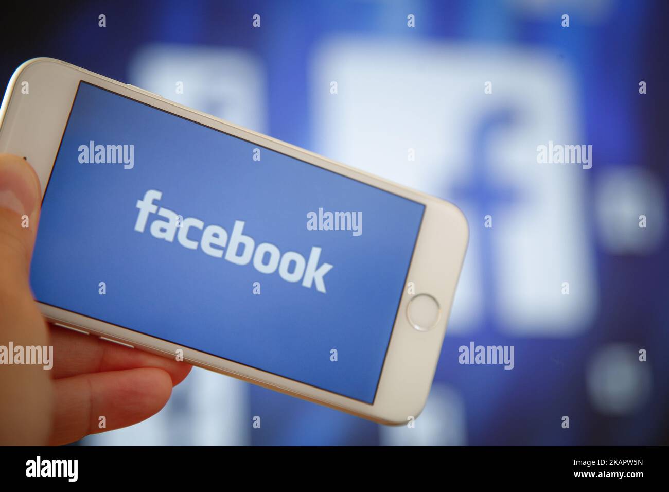 The Facebook logo is seen on an Apple iPhone in this photo illsutration ...