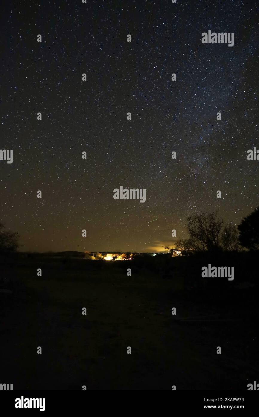A starry night sky over the buildings Stock Photo - Alamy