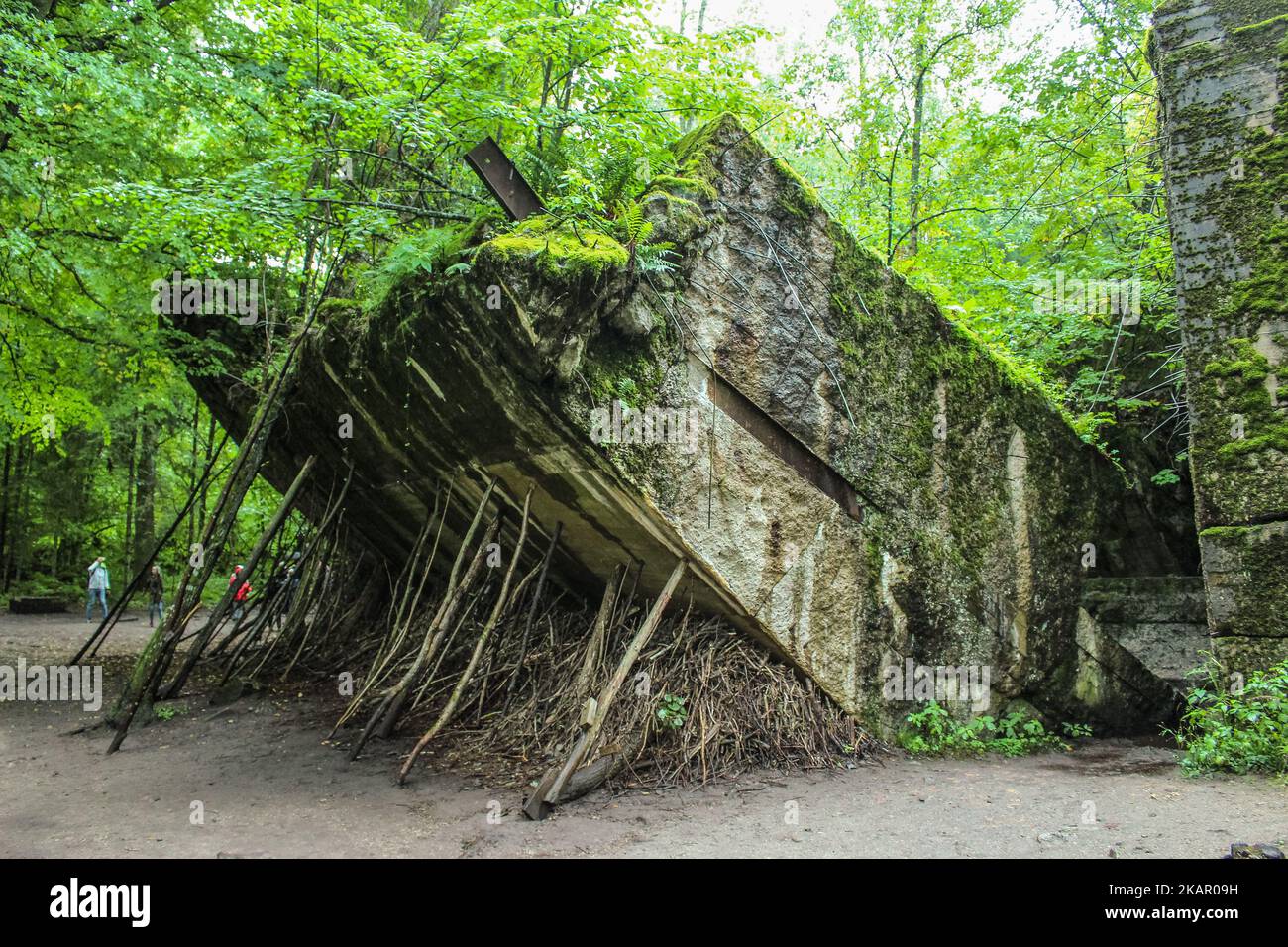 People walking at the Wolf's Lair remains are seen on 2 September 2017 in Gierloz , Poland. Wolf's Lair (ger. Wolfsschanze) ruins of Adolf Hilter's war headquarters is It’s a hidden town in the woods consisting of 200 buildings: shelters, barracks, 2 airports, a power station, a railway station, air-conditioners, water supplies, heat-generating plants and two teleprinters. (Photo by Michal Fludra/NurPhoto) Stock Photo