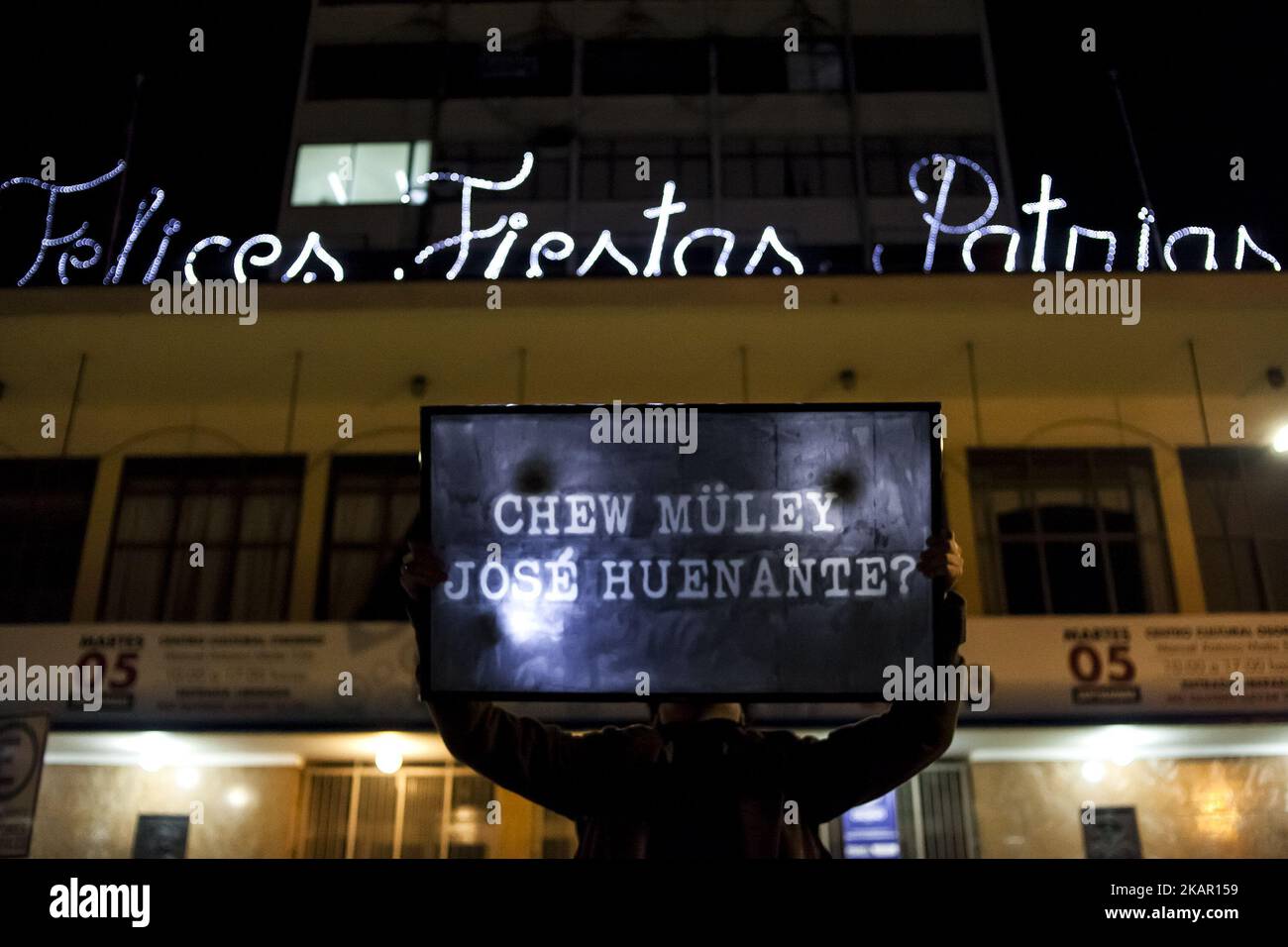 Osorno, Chile. 03 September 2017. Where is José Huenante written in Mapuche language. Mapuche Huilliche visual artist Francisco Vargas Huaiquimilla walks in the city holding a plasma tv with the image and texts referring to the disappearance of the young man José Huenante. José Gerardo Huenante Huenante, a 16-year-old boy, was arrested and made to disappear by the Chilean police on September 3, 2005 in the city of Puerto Montt in southern Chile. José disappears during the government of the Concertación chaired by Ricardo Lagos. He is the second detainee disappeared in civilian governments. The Stock Photo
