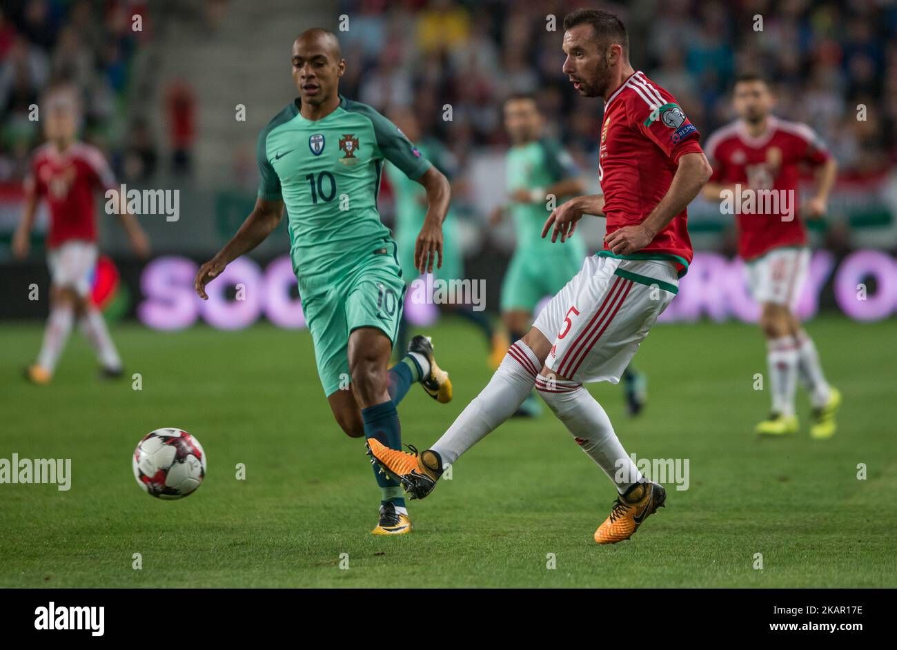 Joao Mario (L) of Portugal in action with Attila Fiola (R) of Hungary during the World Cup qualification match between Hungary and Portugal at Groupama Arena on Nov 03, 2017 in Budapest, Hungary. (Photo by Robert Szaniszló/NurPhoto) Stock Photo