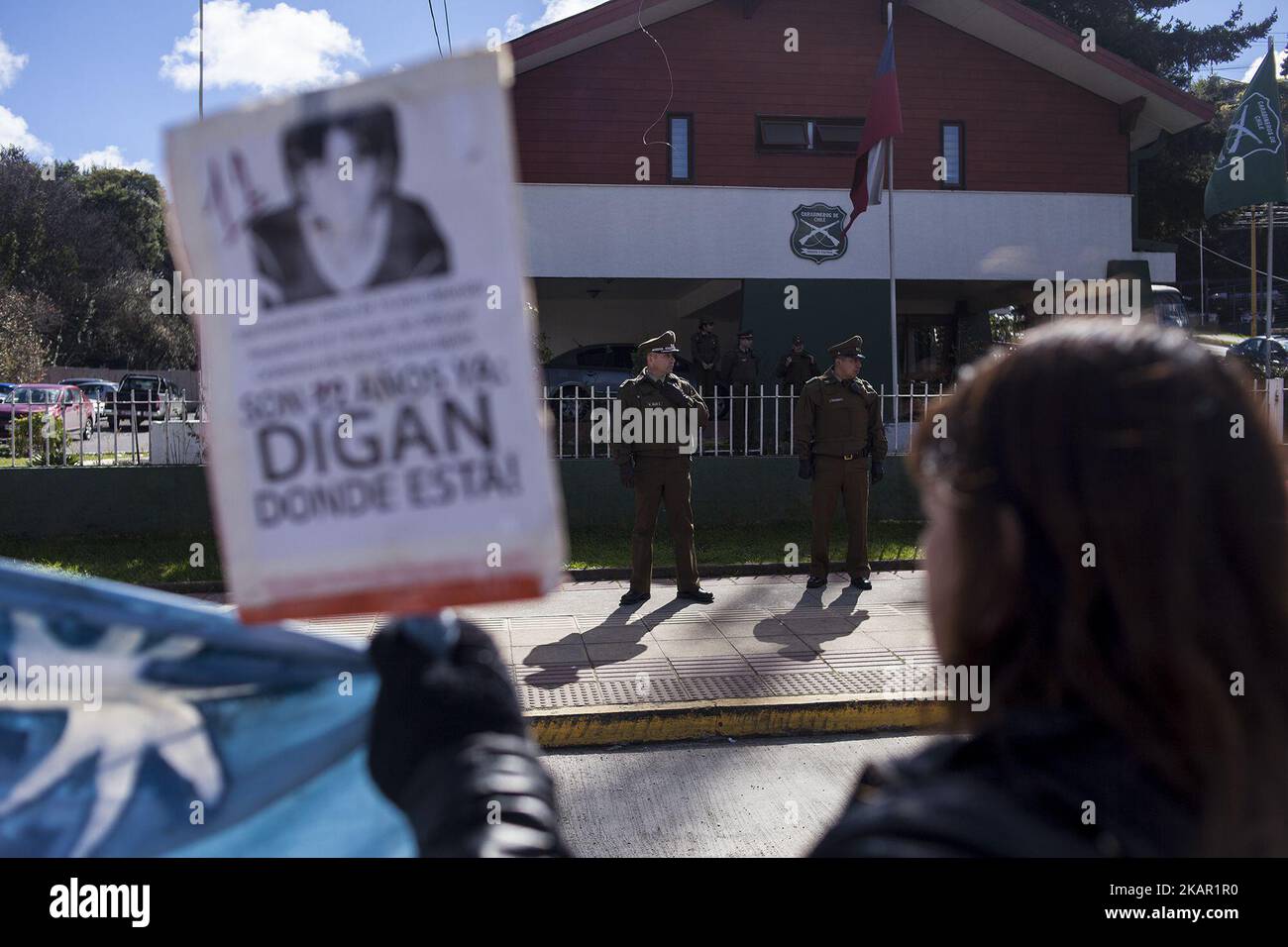 Protestor in front of the police station during a protest to commemorate to commemorate the 12 years of the disappearance of the young José Huenante in Puerto Montt, on September 4, 2017. Relatives and friends held a demonstration to commemorate the 12 years of the disappearance of the young José Huenante at the hands of the Chilean policeJosé Gerardo Huenante Huenante, a 16-year-old boy, was arrested and made to disappear by the Chilean police on September 3, 2005 in the city of Puerto Montt in southern Chile. José disappears during the government of the Concertación chaired by Ricardo Lagos. Stock Photo