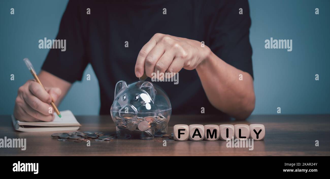 Father and son putting coin piggy bank hi-res stock photography and ...