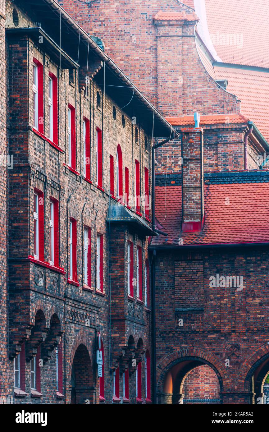 the historic Nikiszowiec housing estate. Traditional Silesian buildings. White windows with a red border Stock Photo
