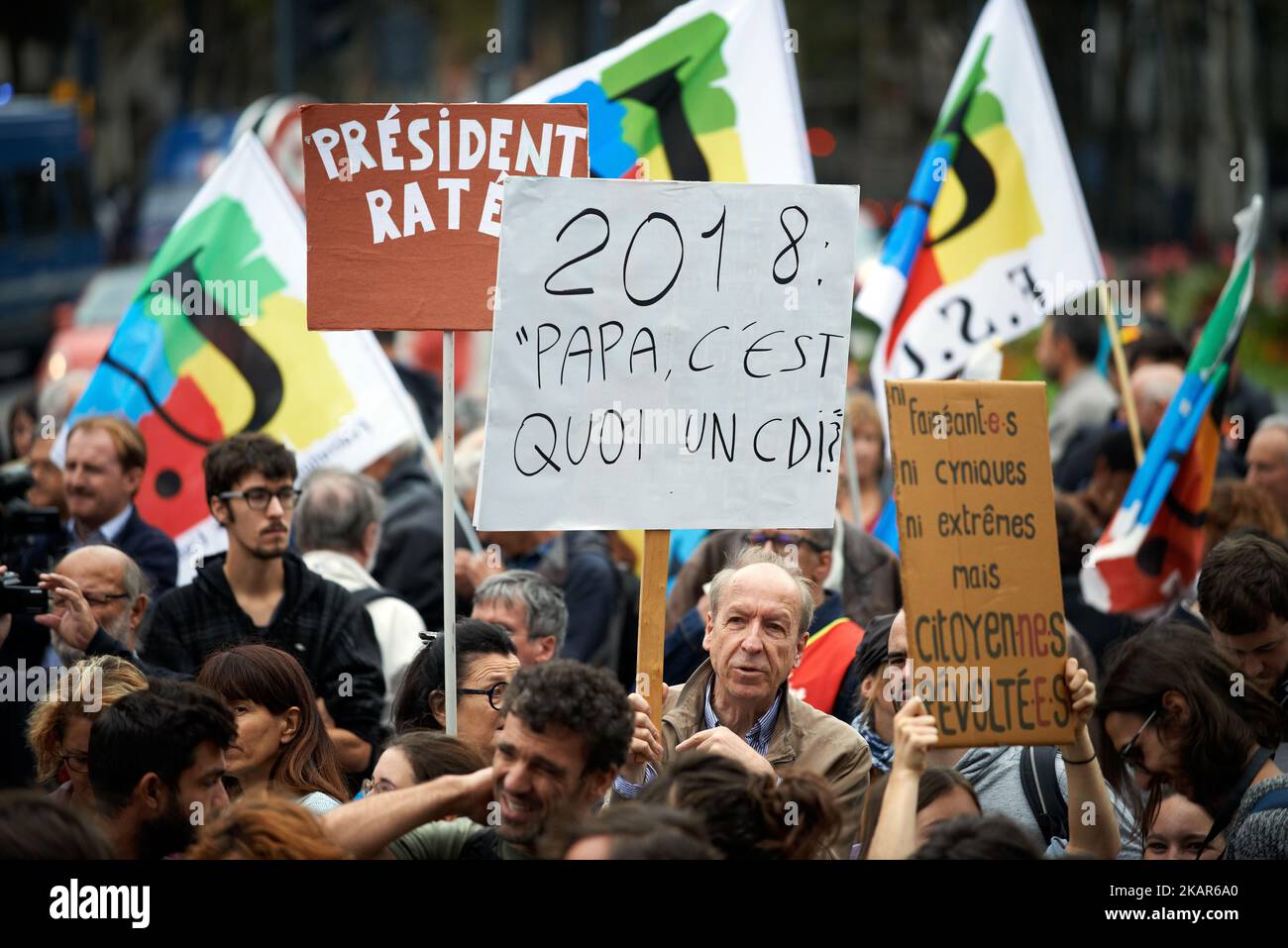 Placards during a gathering against Macron. As Emmanuel Macon came in Toulouse to discuss housing, the Social Front (meeting of political parties and trade unions) gathered in front of the War Memorial of Toulouse to protest against the new labor reform and against the lowering of the personnal housing allowance. Toulouse. France. September 11th 2017. (Photo by Alain Pitton/NurPhoto) Stock Photo