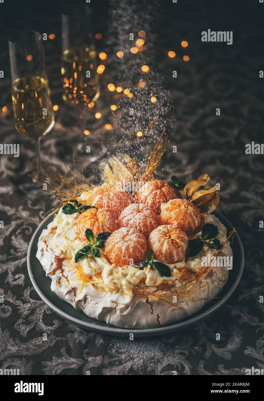 Pavlova cake low light still life pouring with powder sugar meringuebased dessert named after