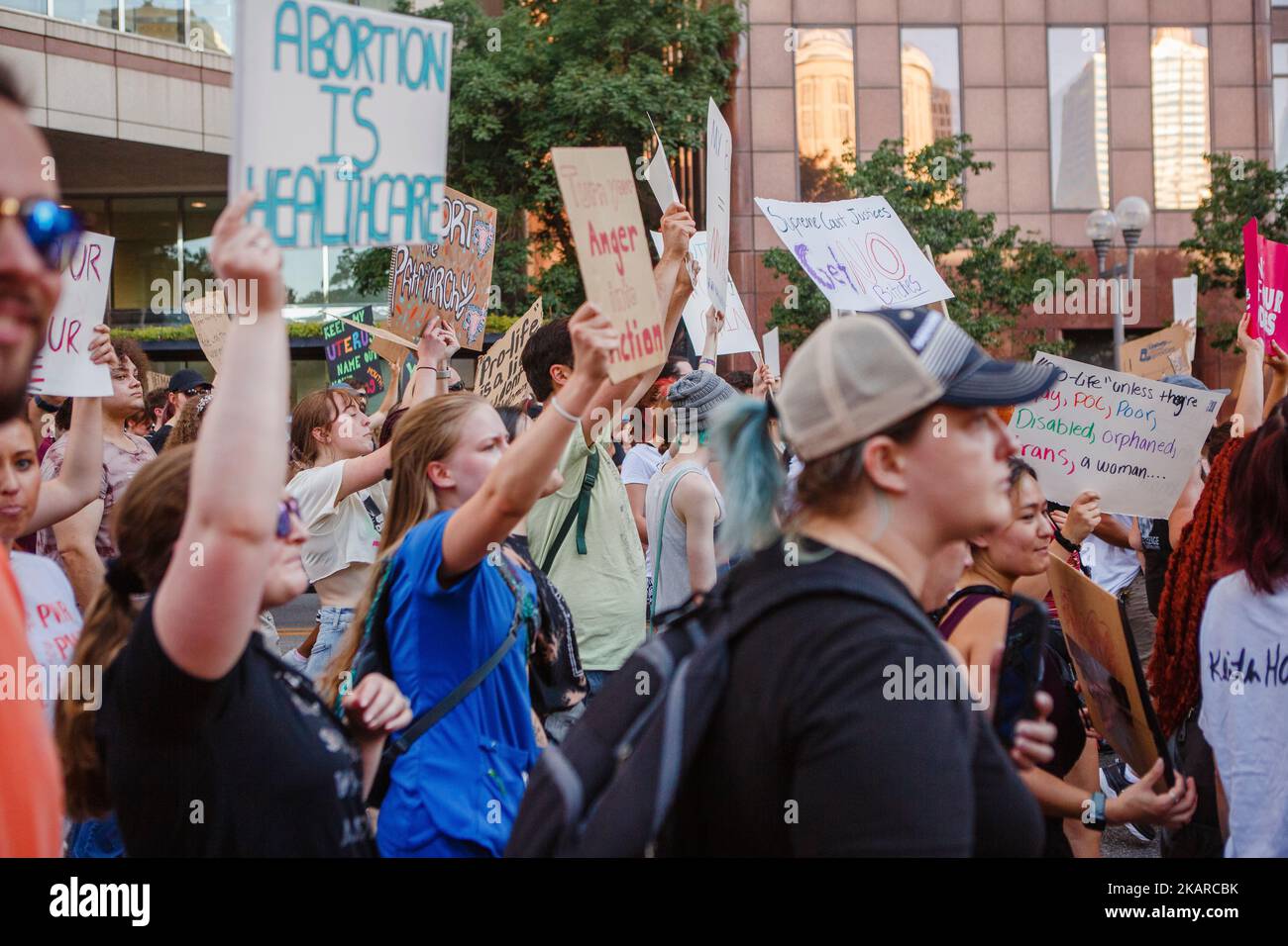 A crowd marches for abortion rights holding protest signs Stock Photo