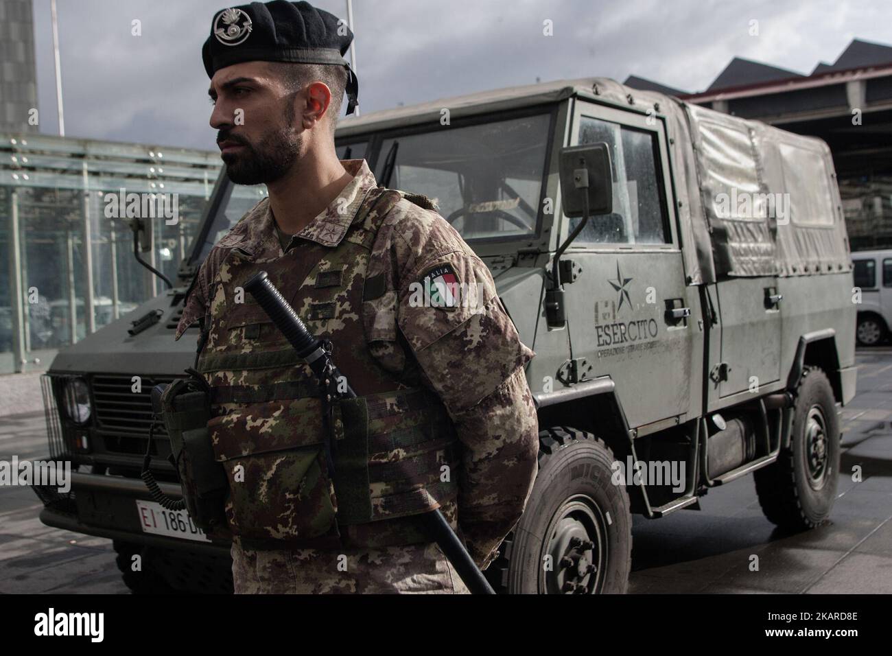 Italian troops stand guard outside the Central Station by Naples ...