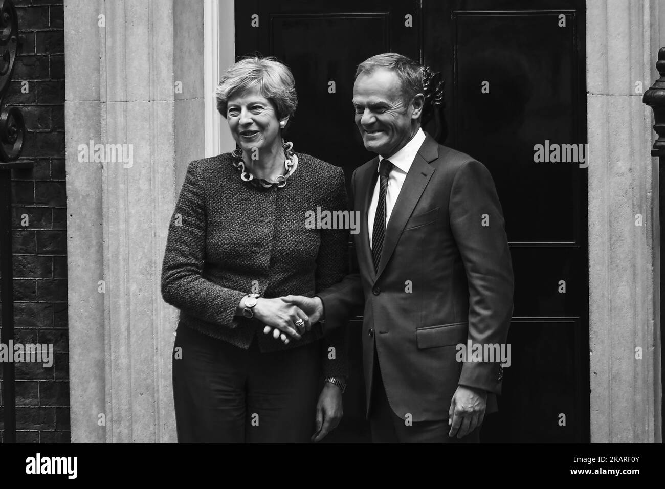 British Prime Minister Theresa May (L) greets President of the European Council, Donald Tusk in Downing Street, London on September 26, 2017. Theresa May welcomed the President of the European Council, Donald Tusk, to Downing Street for the first time since she set out plans for a two-year transition period post-Brexit. (Photo by Alberto Pezzali/NurPhoto) Stock Photo