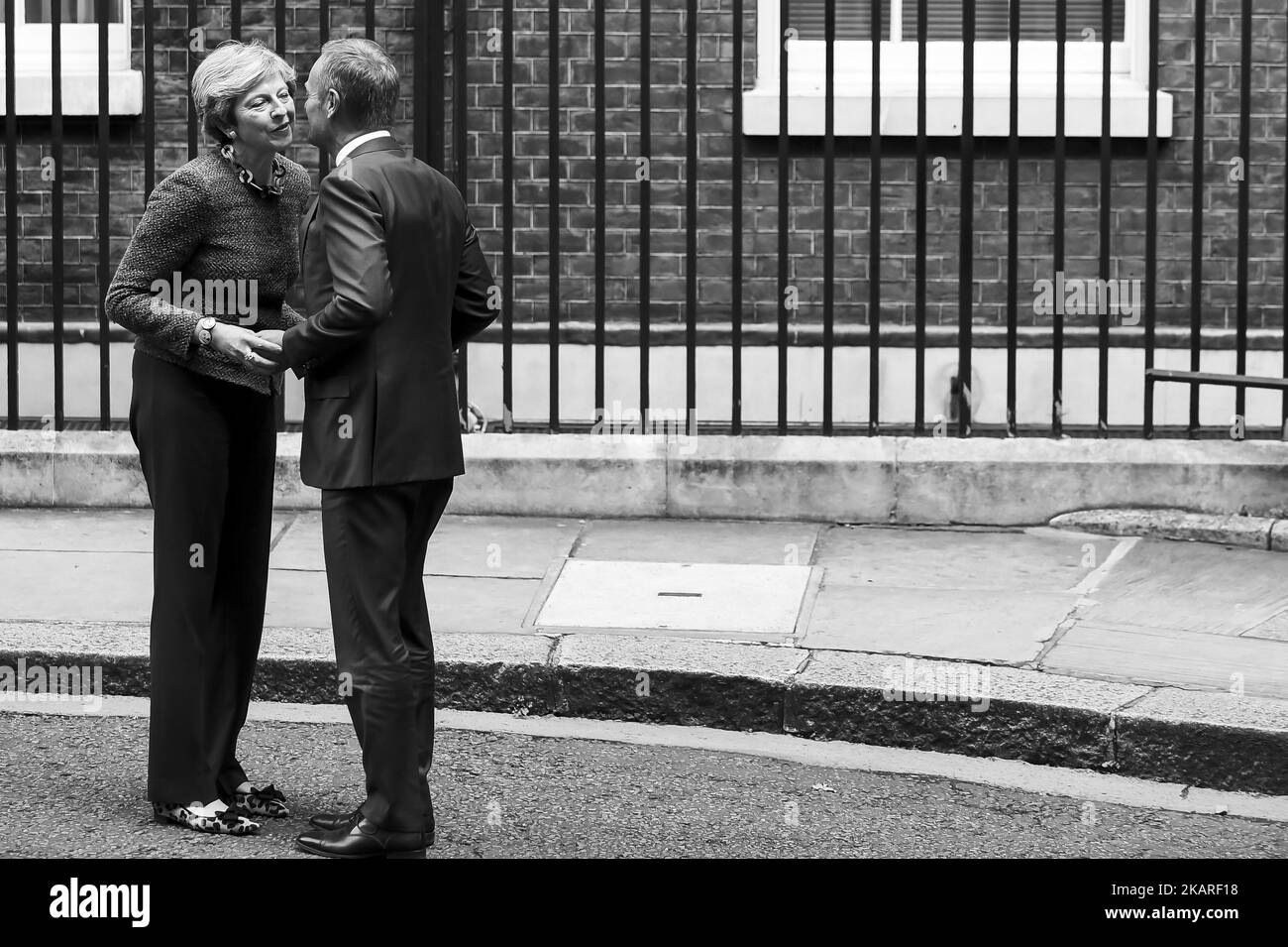 British Prime Minister Theresa May (L) greets President of the European Council, Donald Tusk in Downing Street, London on September 26, 2017. Theresa May welcomed the President of the European Council, Donald Tusk, to Downing Street for the first time since she set out plans for a two-year transition period post-Brexit. (Photo by Alberto Pezzali/NurPhoto) Stock Photo